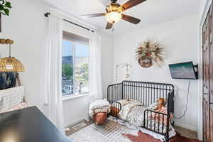 Bedroom featuring baseboards and a ceiling fan