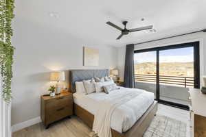 Bedroom with access to outside, light wood finished floors, baseboards, and ceiling fan