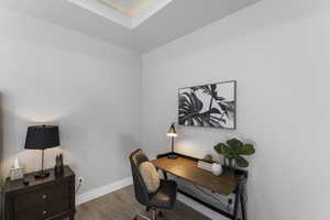 Office space featuring wood finished floors and baseboards