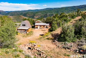 View of subject property featuring a mountainous background