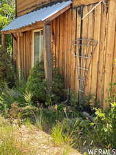 View of outdoor structure featuring fence