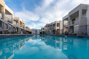 View of swimming pool with a residential view