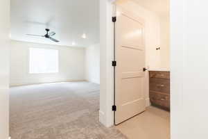 Unfurnished room with a ceiling fan, baseboards, light colored carpet, and recessed lighting
