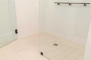 Bathroom with tile patterned flooring