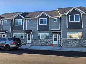 Multi unit property with entry steps and stone siding