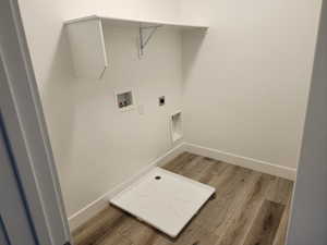 Laundry room featuring washer hookup, light wood-type flooring, baseboards, and electric dryer hookup
