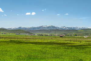 View of mountain background with rural landscape and agricultural land