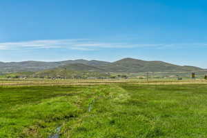 View of mountain background featuring rural landscape and agricultural land