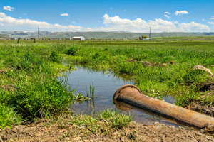 Water view featuring mountains and rural landscape