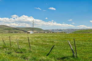 View of mountain background with rural landscape and agricultural land