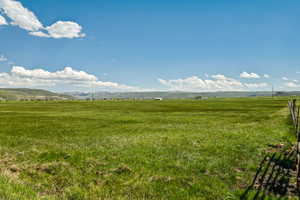 View of yard featuring a view of countryside and a mountain view
