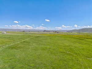 View of yard featuring a view of countryside and a mountain view