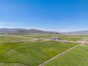 View of mountain backdrop featuring rural landscape
