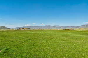 View of mountain background with rural landscape and agricultural land