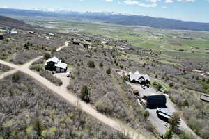 Aerial view of sparsely populated area featuring a mountainous background