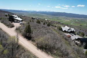 Aerial view of sparsely populated area featuring a mountain backdrop