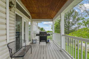 Wooden terrace with a grill