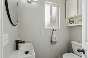 Half bathroom featuring toilet
