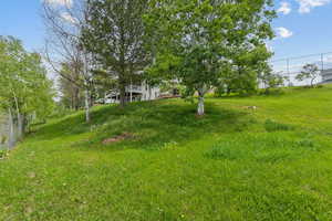 View of yard featuring fence