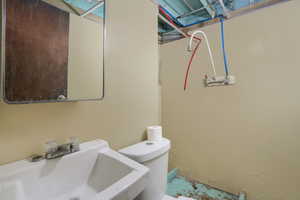 Bathroom featuring a sink and toilet
