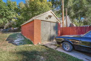View of shed with fence
