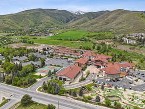 Aerial view of property's location with a mountain backdrop