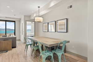 Dining room featuring light wood-style flooring, baseboards, and recessed lighting