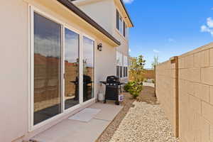 View of patio / terrace featuring a fenced backyard and a grill