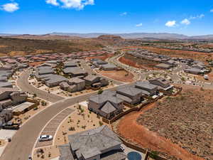 Aerial perspective of suburban area featuring a mountain backdrop