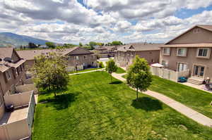 View of yard with a residential view and a mountain view