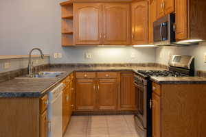 Stainless steel appliances with lots of cabinet storage.