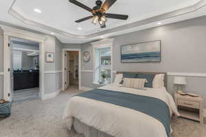 Primary Bedroom with new light colored carpet, a tray ceiling, recessed lighting, a spacious closet, and ensuite bath.