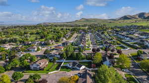 View of property location featuring nearby suburban area and a mountain backdrop