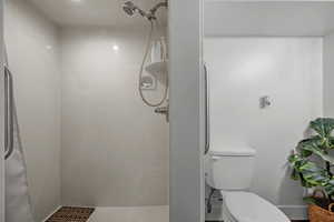Full bathroom with a shower and toilet