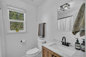 Bathroom with toilet and vanity