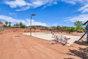View of home's community featuring fence