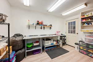 Misc room with light wood-style floors