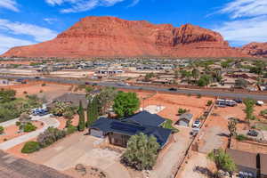 Aerial perspective of suburban area with a mountainous background