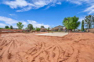 View of yard featuring fence