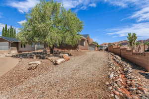 View of front of house with a residential view, fence, and brick siding