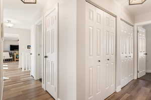 Hall featuring wood finished floors and baseboards