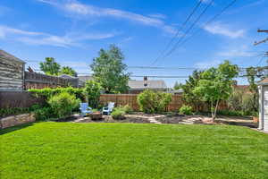 View of yard with an outdoor fire pit
