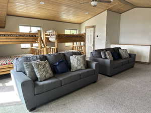 Carpeted living room with wooden ceiling, lofted ceiling, and a ceiling fan
