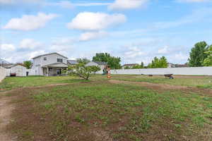 View of yard with a playground, a shed, and an outbuilding