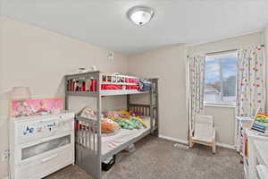 Bedroom with carpet and baseboards