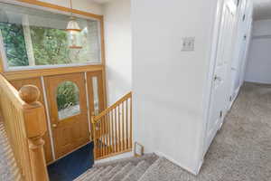 View of carpeted entrance foyer