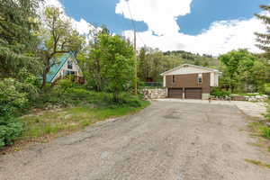 View of front of house with a garage and driveway