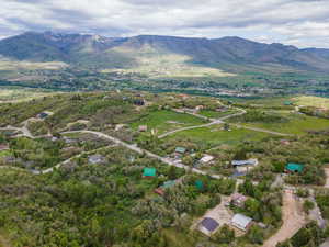 Aerial overview of property's location with a mountainous background