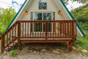 Back of property with a wooden deck