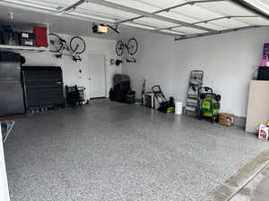 Garage featuring a garage door opener